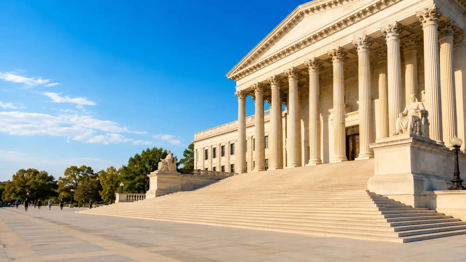 A neoclassical government building with stone columns in afternoon sunlight, people crossing the plaza